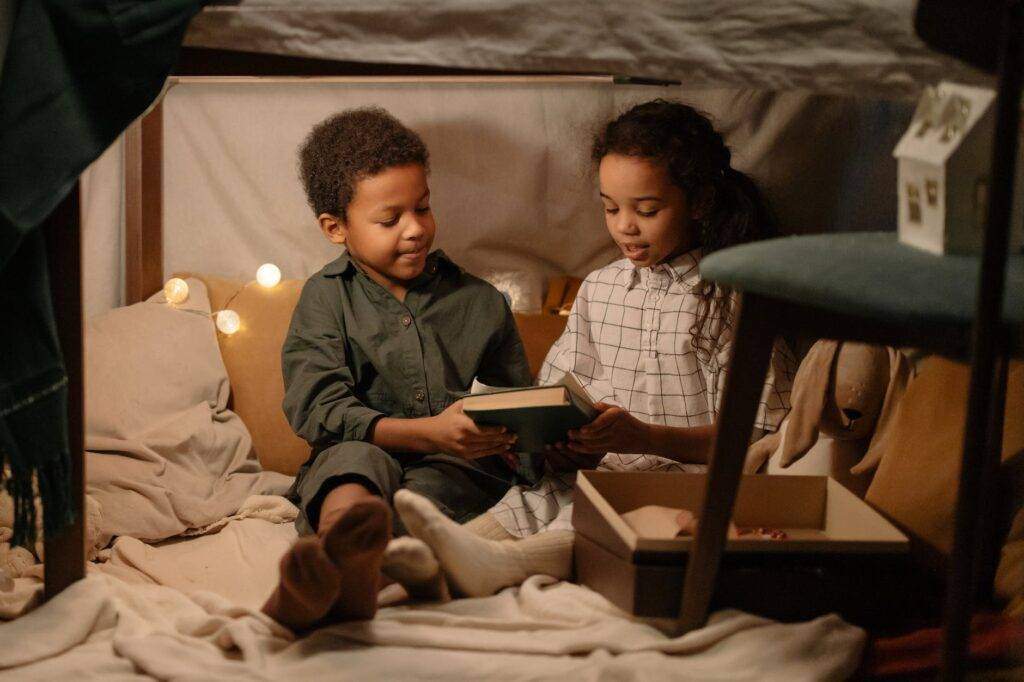 kids sitting under the table