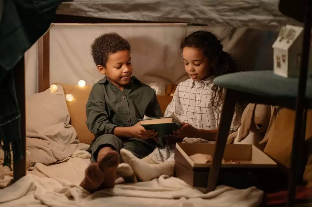 kids sitting under the table